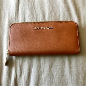 Michael Kors brown wallet.